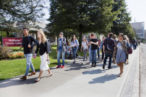 group of students walking around campus